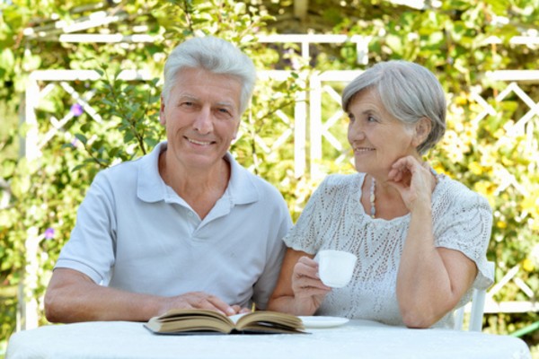 Older couple sitting in their garden